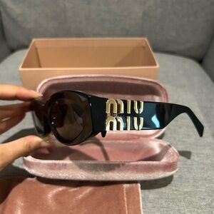 Miu Miu black oval sunglasses MU 11WS